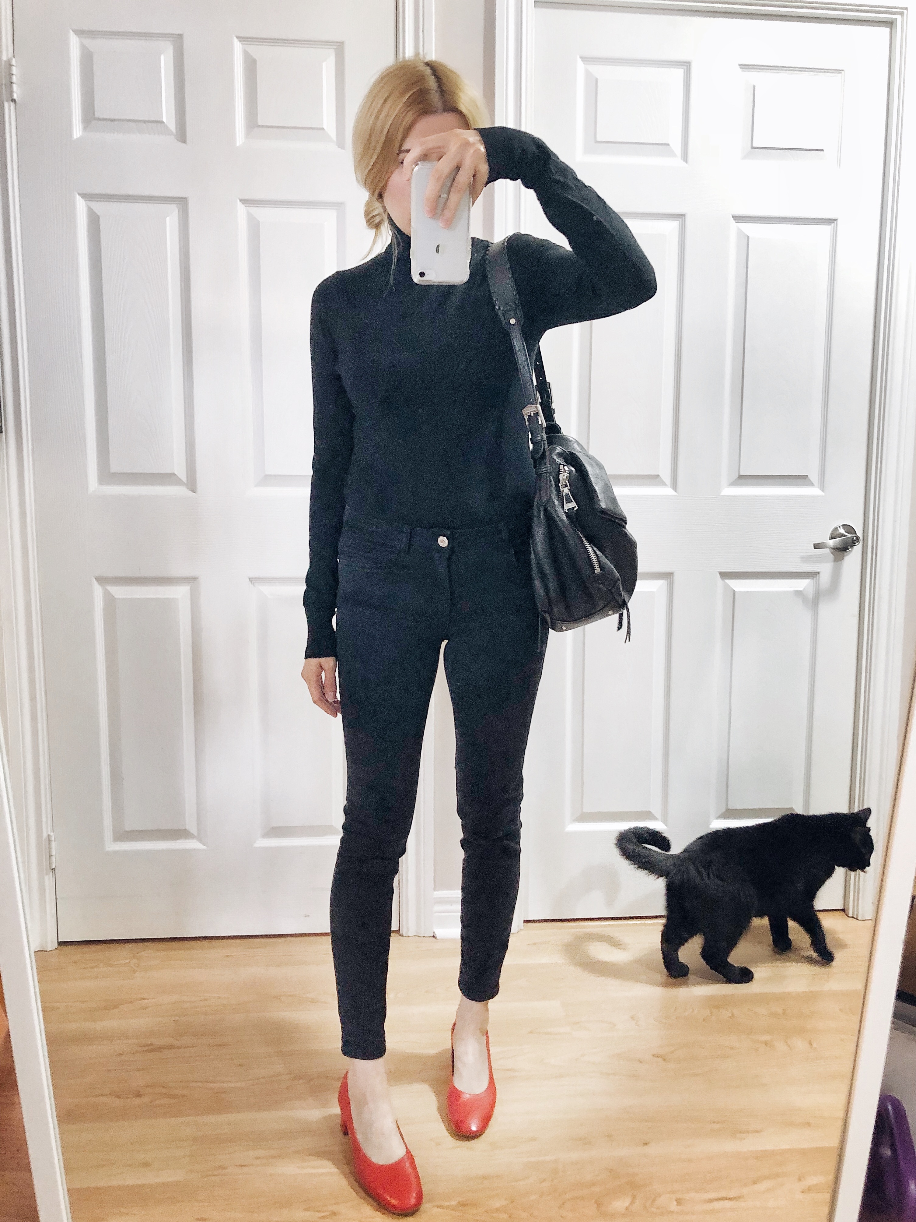 What I wore. A black turtleneck, black skinny jeans, and Red Everlane Day Heels.