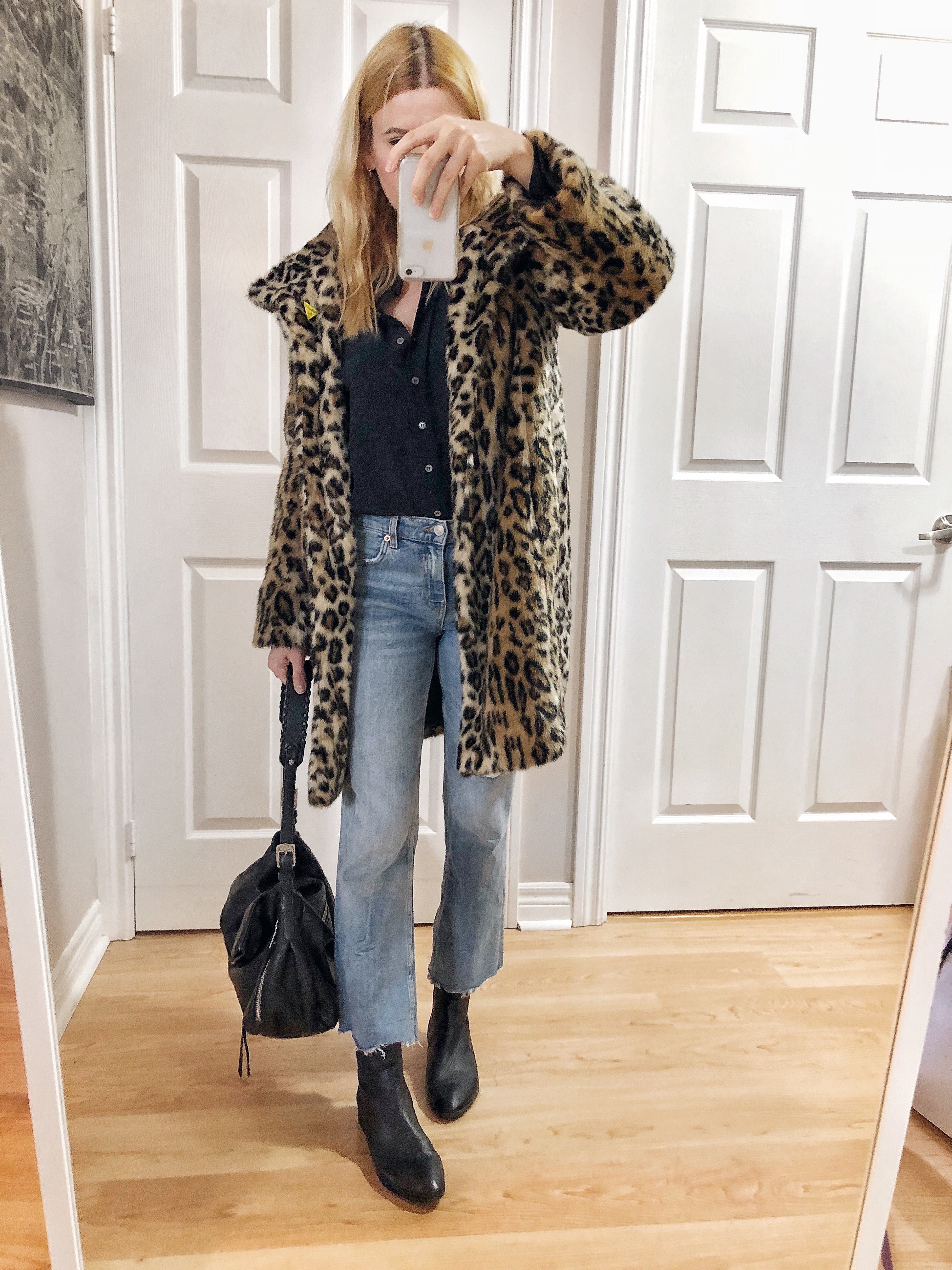 What I Wore. I am wearing a black silk blouse, cropped jeans, animal print jacket, and a black boots.
