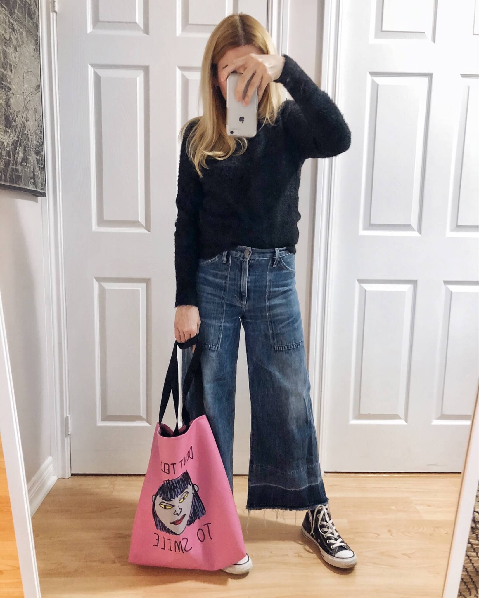 What I Wore. I am wearing a black sweater, wide leg cropped jeans, my new tote from Look Human, and converse. #livelovesara
