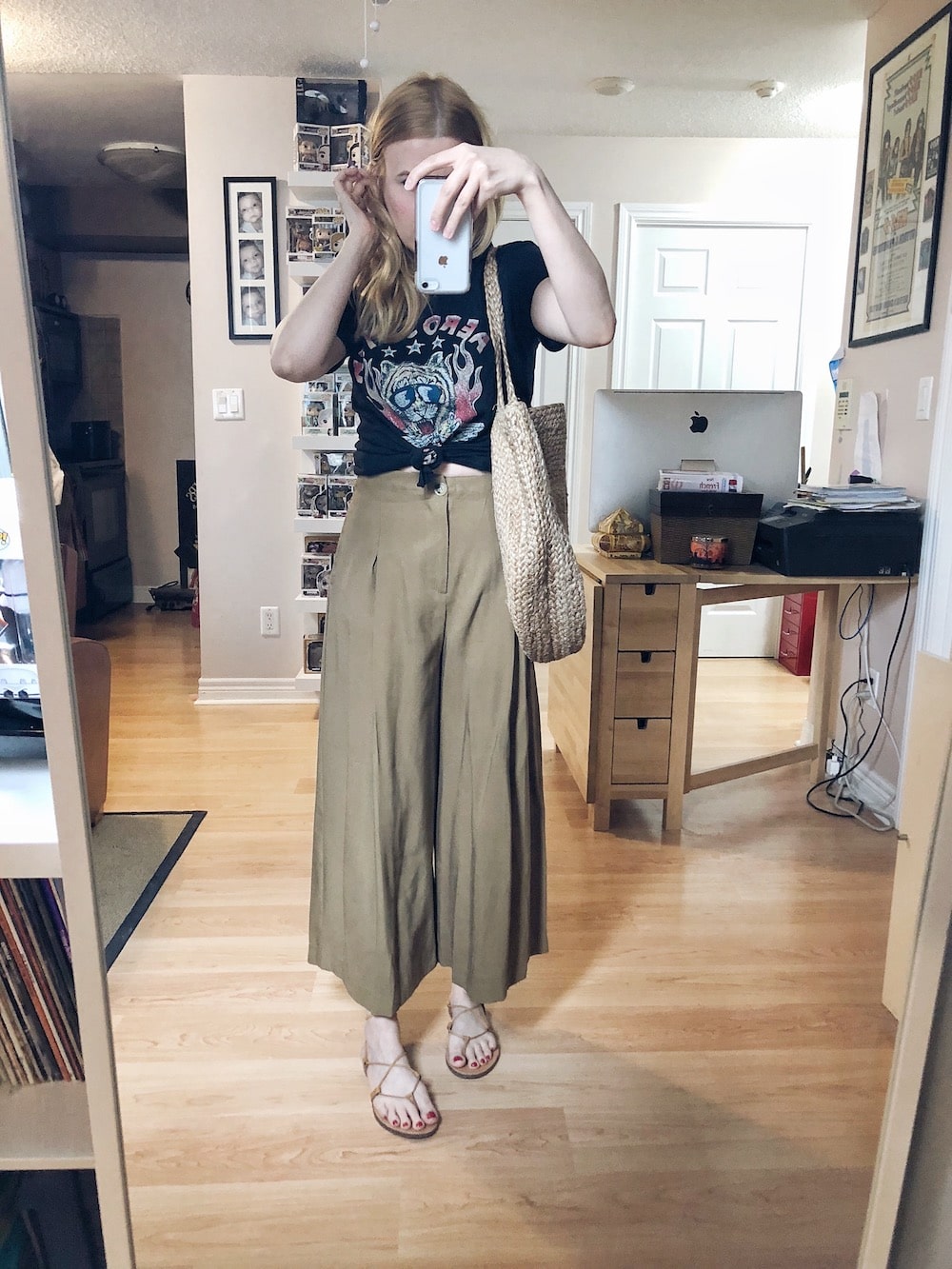 I am wearing an Aerosmith t-shirt by Dirty Cotton Scoundrels, Wide leg, high waist trousers, Madewell Boardwalk Sandals, and a woven circle purse. 