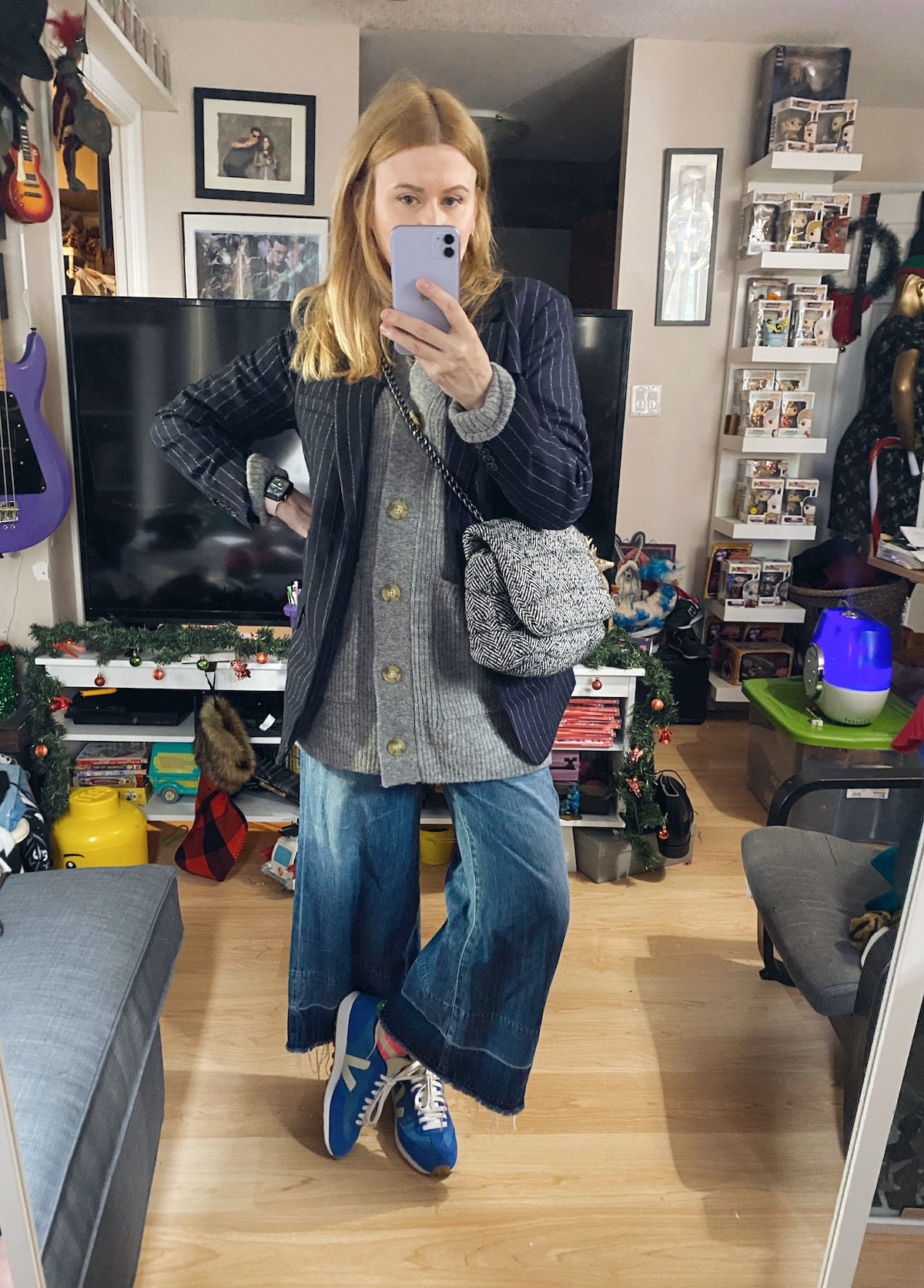 I am wearing a grey cardigan, navy striped blazer, wide leg jeans, Vejas and a Zara Bag.