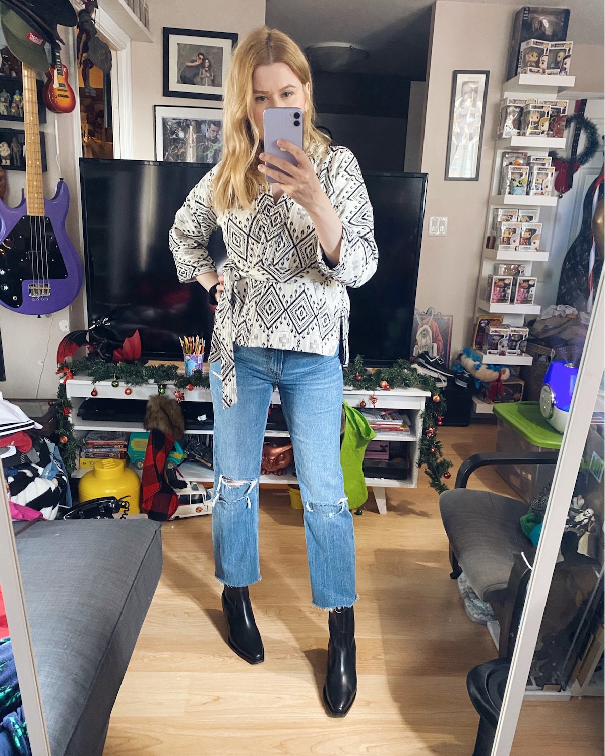 I am wearing a Madewell wrap shirt, Abercrombie jeans, and Everlane bpots.