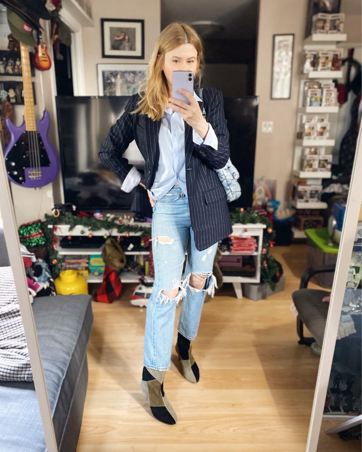 I am wearing a blue button up, Everlane Blazer, Levis, Isabel Marant boots, and a Zara Bag.