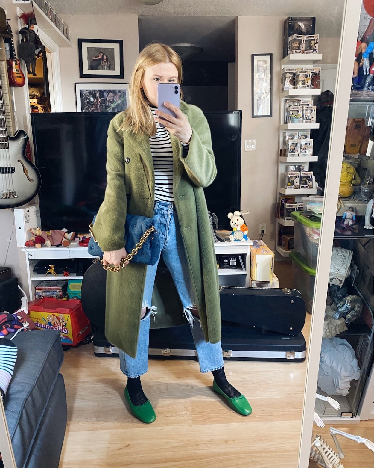 I am wearing a striped turtleneck, levis, a green faux fur coat, and green flats
