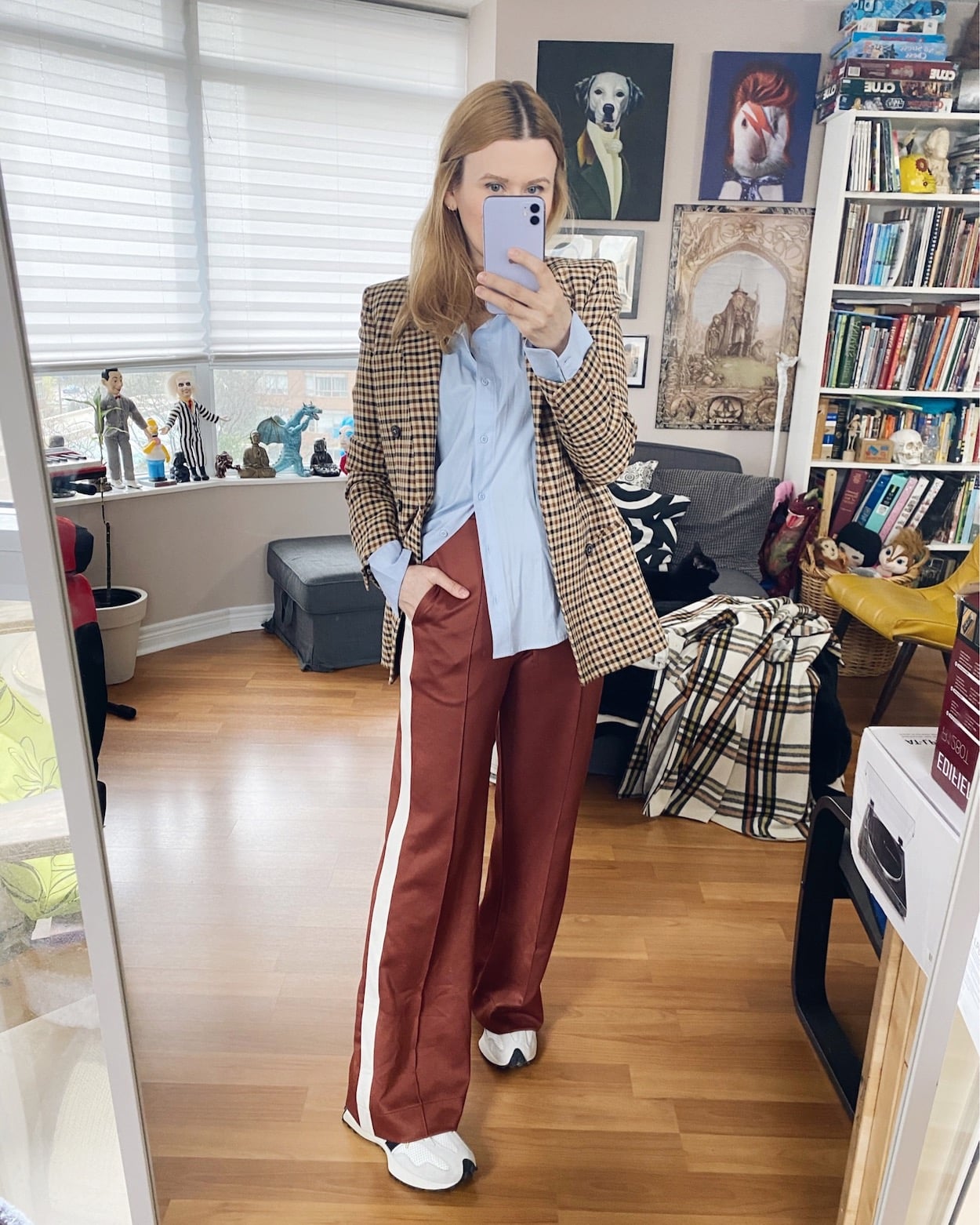 I am wearing a blue button down, a checkered blazer, brown track pants, and New Balance 327