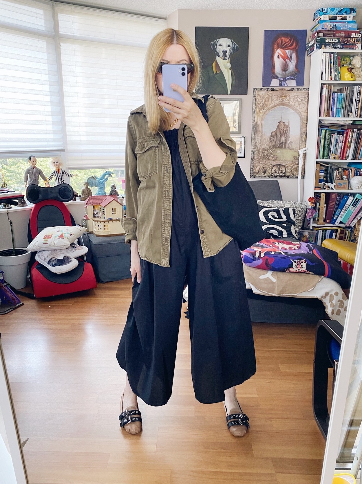 I am wearing an Everlane black jumpsuit, a cargoshirt, Miu Miu flats, a black tote, and Chanel Cat Eye sunglasses.