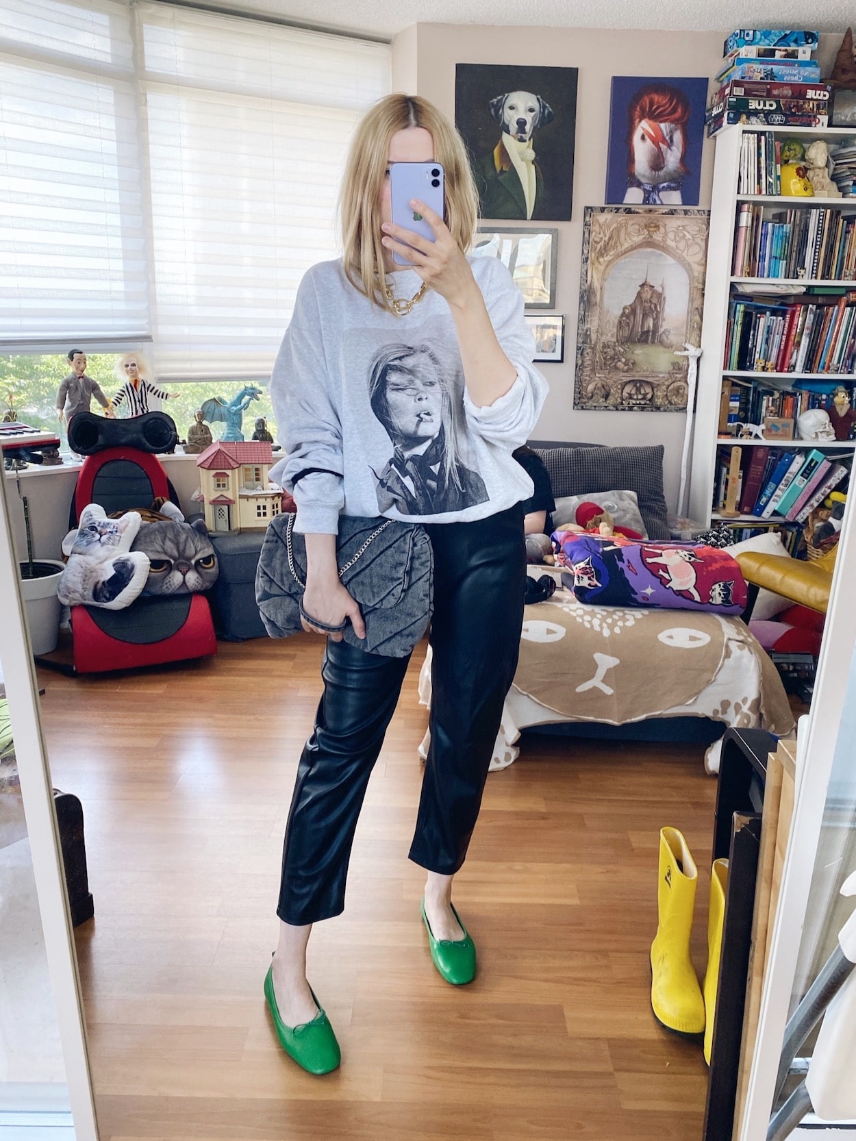 I am wearing an Anine Bing sweatshirt, faux leather trousers, a Jenny Bird necklace, green flats, and a grey Zara bag.