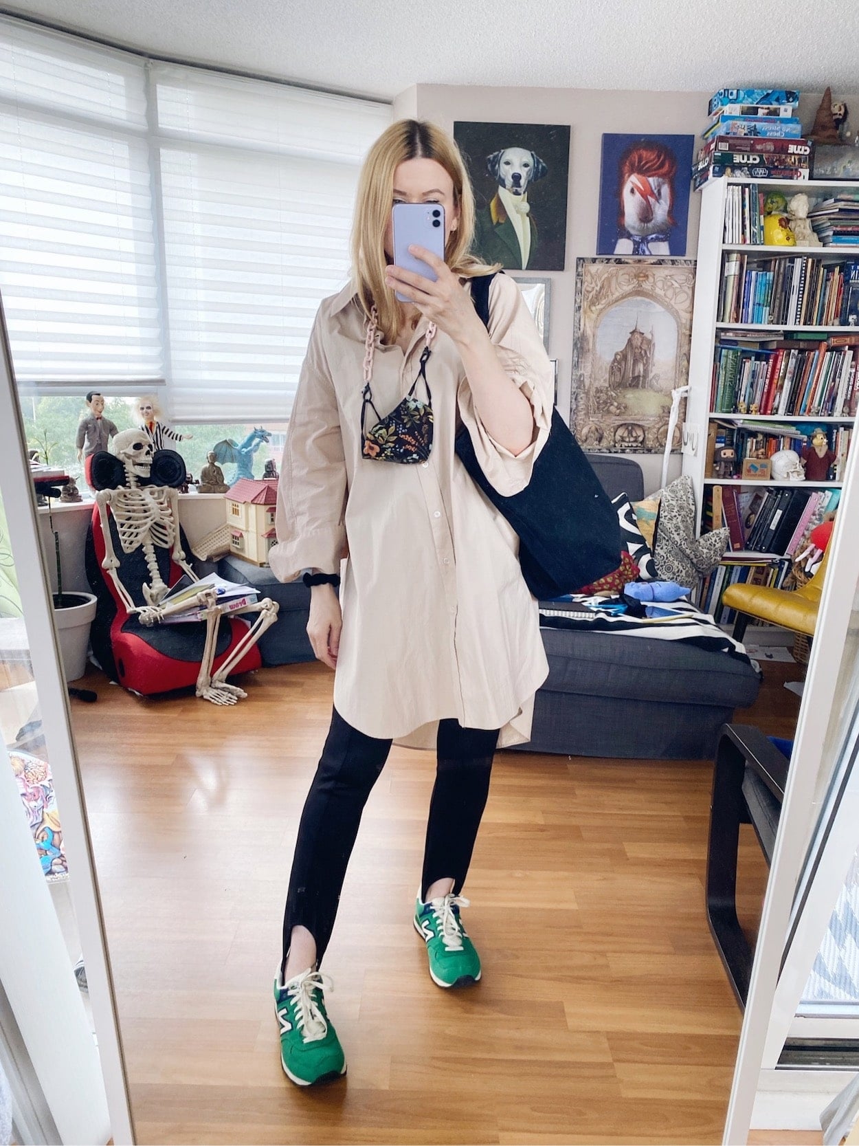 I am wearing an oversized button up, black stirrups, a black tote, and green vintage New Balance.