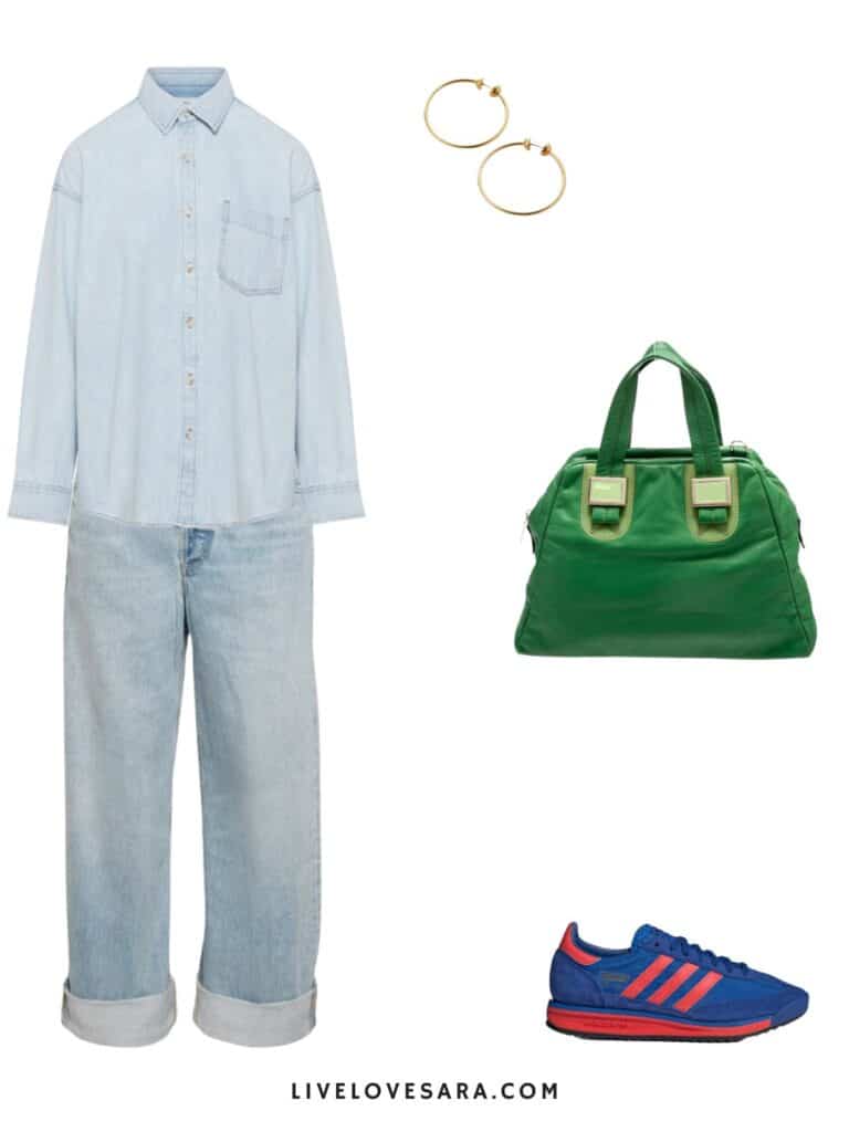An image of an outfit with a denim shirt pair with cuffed denim, a green handbag, blue and res Adidas, and hoop earrings.