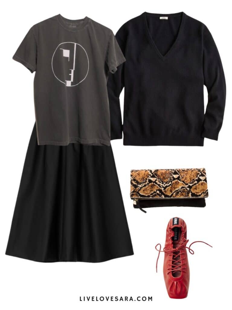 A photo of an outfit of a Bauhaus tee, with a black midi skirt, a black v-neck sweater, red flats, and a snake print clutch.