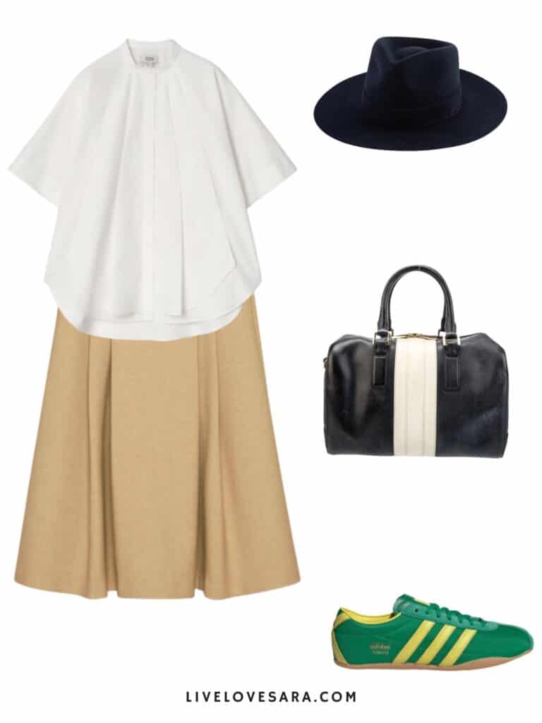 A photo of an outfit of a white shirt sleeve button up, camel midi skirt, green retro sneakers, a fedora, and a black and white handbag.