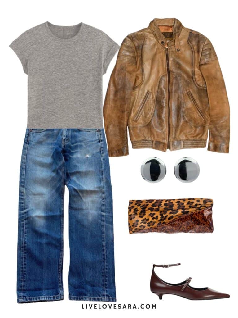 A photo of an outfit of a grey tee with vintage levis, and a vintage leather jacket, kitten heels, round earrings, and an animal print clutch