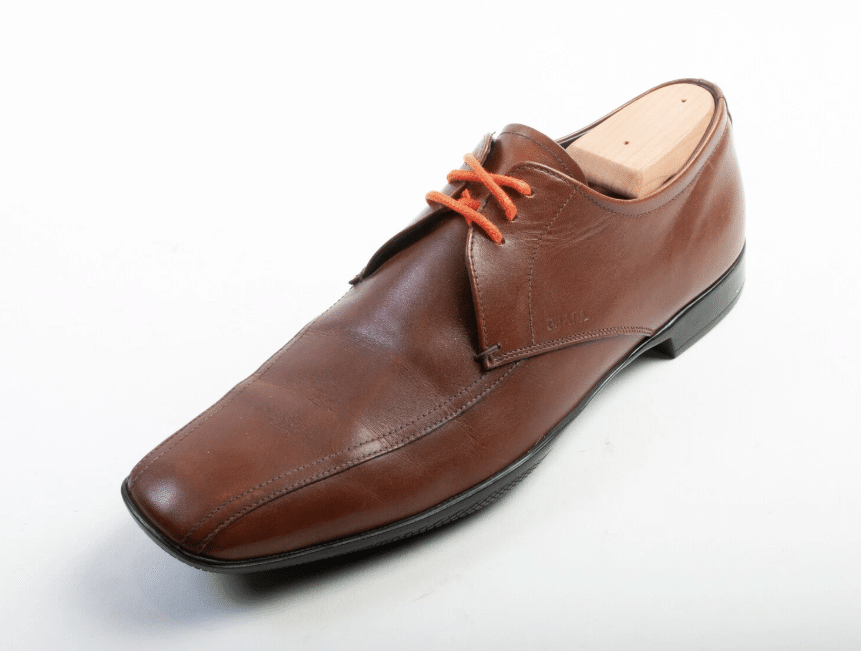 brown derby shoe with orange laces
