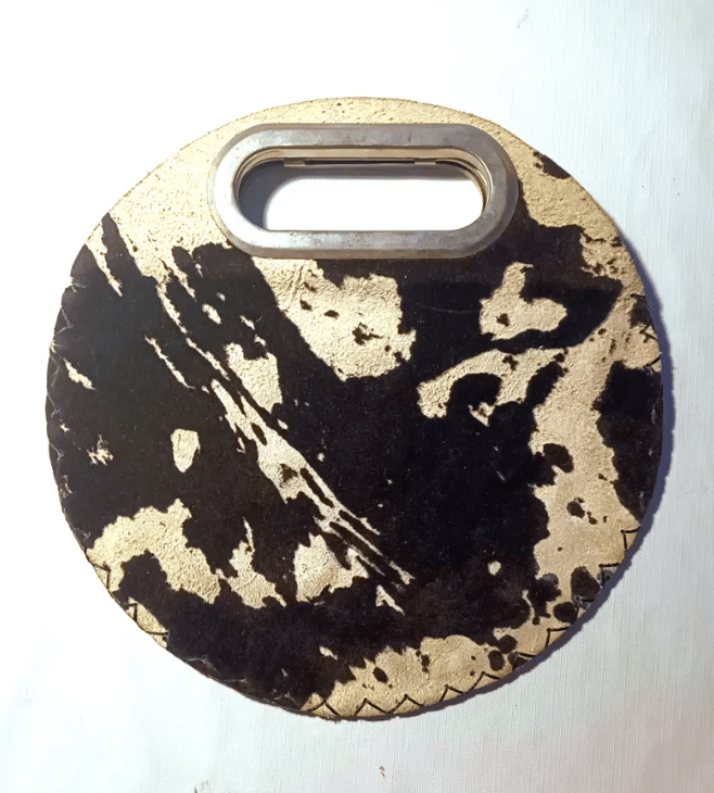 vintage cowhide circle clutch