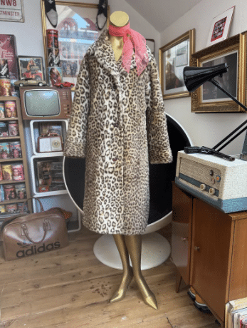 Vintage 1960s 70’s Astraka leopard print knee length faux fur long coat