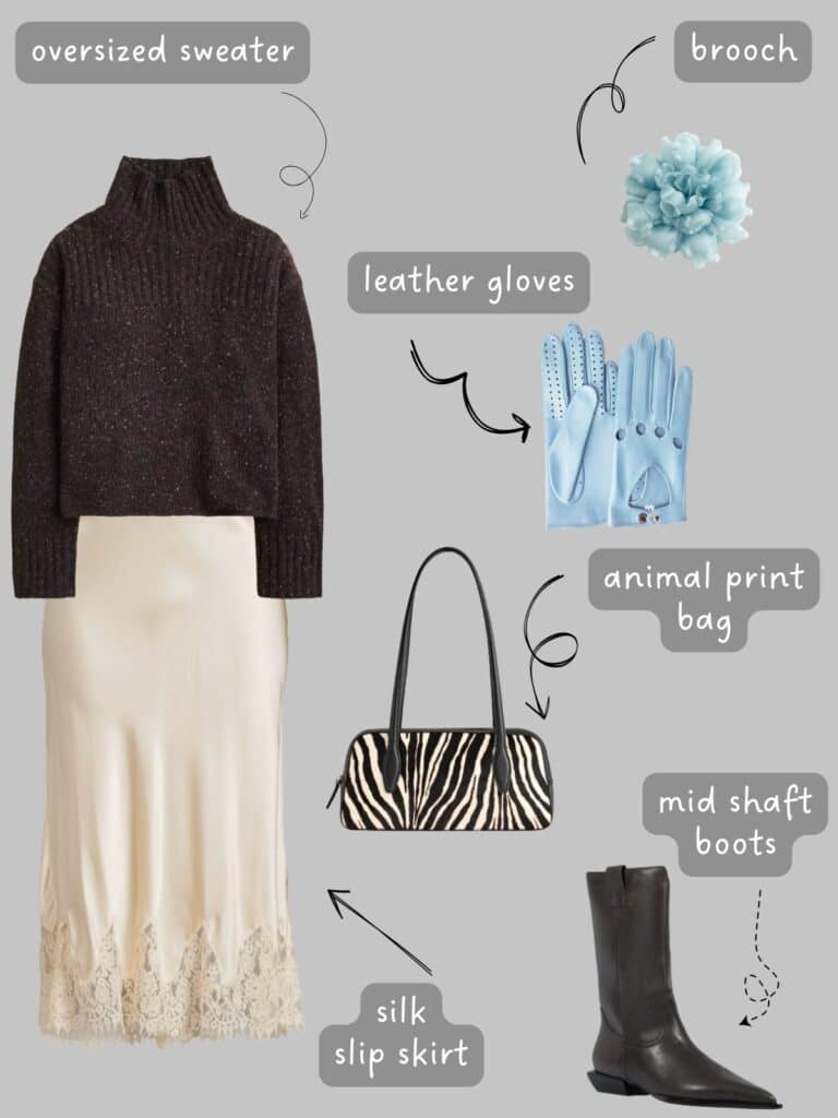A photo of an outfit of an oversized brown sweater, cream silp skirt, black mid boots, blue leather gloves a flower brooch, and a zebra print bag.