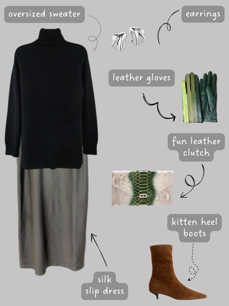 A photo of an outfit of an oversized cashmere turtleneck sweater over a grey slip dress, green leather gloves, silver earrings, a snake print clutch, and brown suede boots.