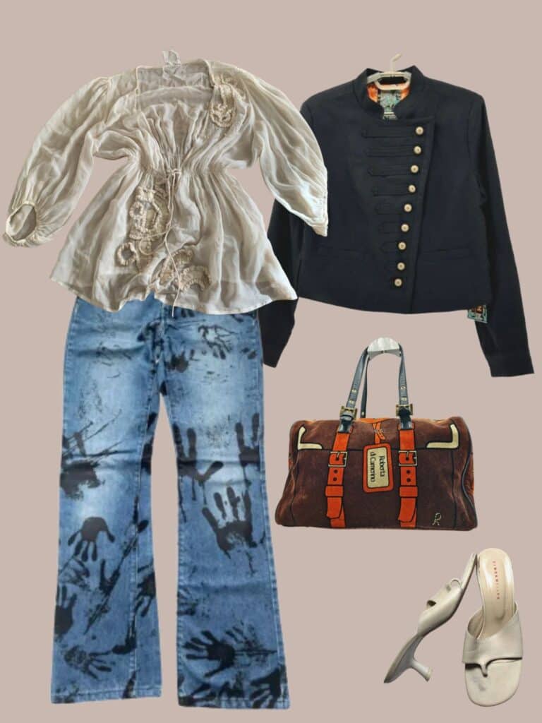 A photo of an outfit of a semi sheer, cream blouse under a black Napoleon jacket. Blue jeans with black painted hand prints on them, cream thong, kitten heels, and a brown trompe l'oeil bag.