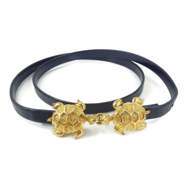 Vintage, navy blue leather belt with large gold tone turtle claps.