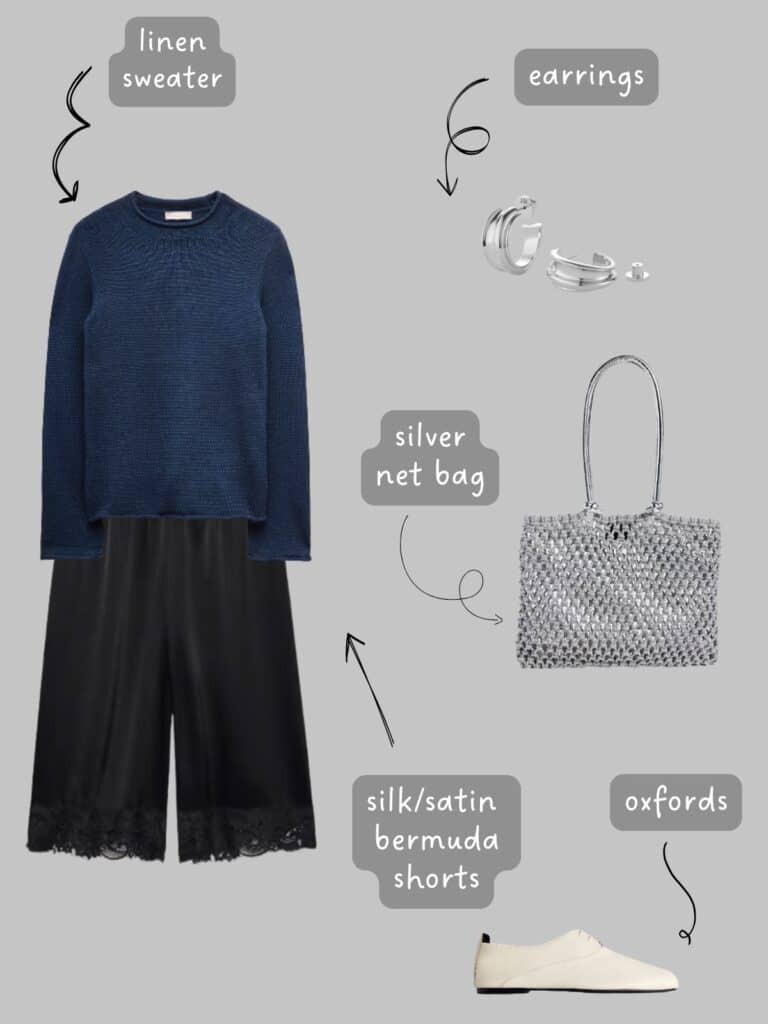 A photo of an outfit of a navy blue linen shirt, with black silk bermuda shorts, cream oxfords, a silver net bag, and silver earrings.