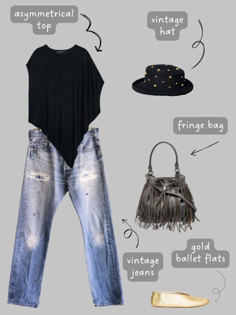 A photo of an outfit of a black asymmetrical top with vintage Levis, a studded vintage hat, a fringe bucket bag, and gold ballet flats.