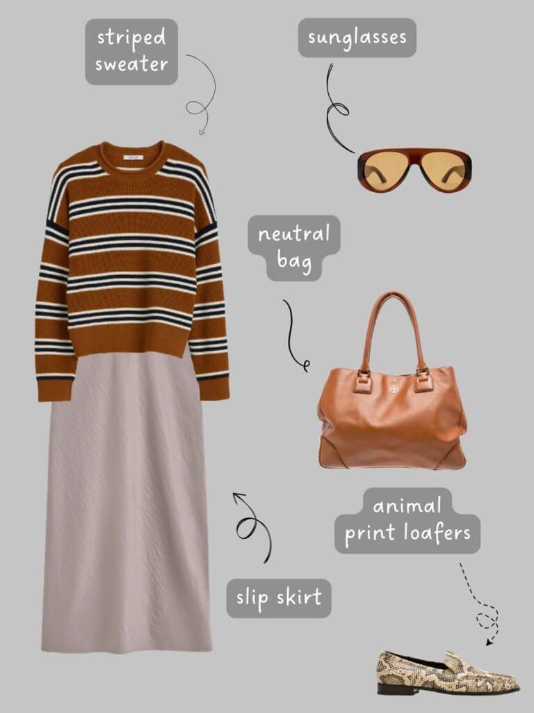 A photo of an outfit of a brown striped sweater with a dove grey slip skirt, a cognac hand bag, brown sunglasses, and snake print loafers.