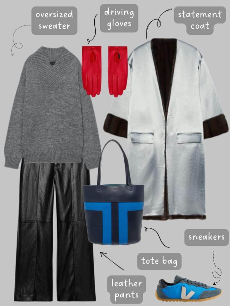 A photo of an outfit of an oversized grey sweater with black faux leather pants, a silver statement coat, red leather driving gloves, a blue and black tote, and blue veja sneakers.
